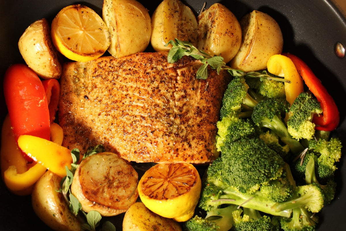 Greek salmon and roasted vegetables cooked together in one pan